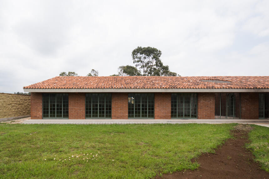 A brick house with a pitched roof.